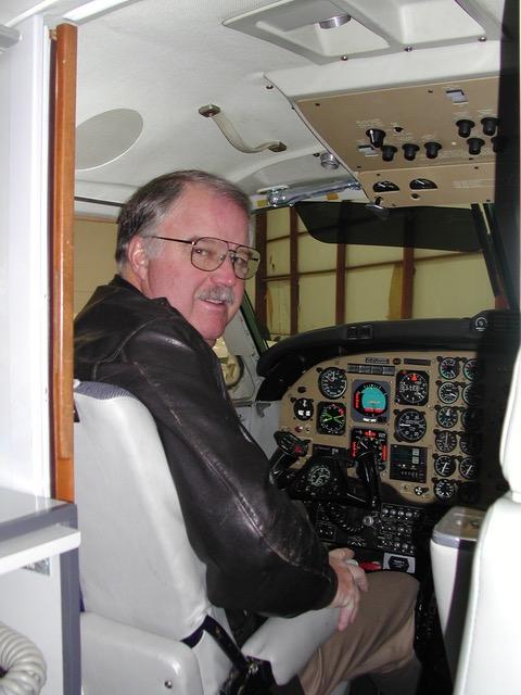 D.A. Francis in the cockpit of a civilian aircraft